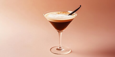 Floating vanilla espresso martini with vanilla bean garnish on a pastel coffee-colored background