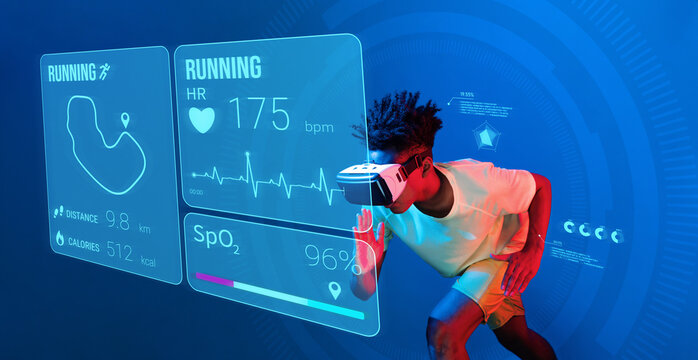 African man jogging or using augmented reality goggle and artificial intelligence practicing and training. Male model with shirt doing running posture and looking at hologram. Technology. Ingenuity.