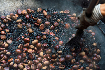 Traditional chestnut roasting in Hong Kong street market
