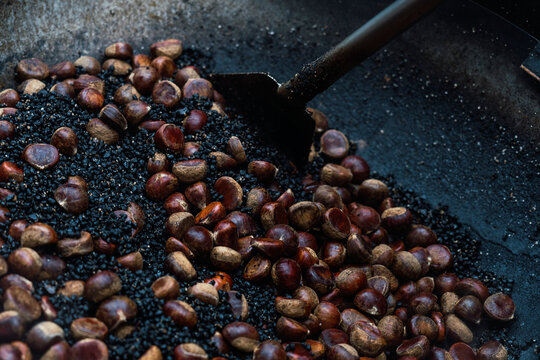 Close-up of chestnuts roasting on an open fire in Hong Kong
