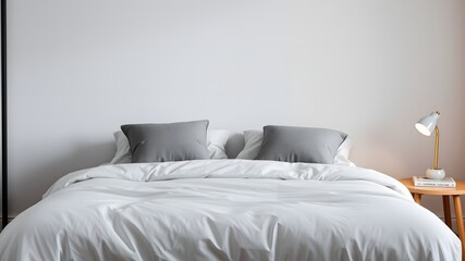 Minimalist White Bedroom with Gray Accents and Simple Decorated Items for Relaxation and Comforting