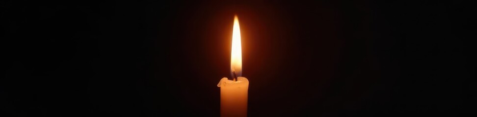 Single candle flame against pure black, intense light source, candlelight, interior, comfort