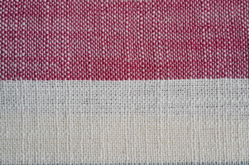 Fototapeta premium grey red and white woven fabric texture macro as a background, macro texture of fabric fibres 