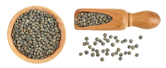 raw french green lentils in wooden bowl and scoop isolated on white background. Top view. Flat lay