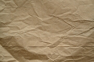 brown crumpled paper texture as background, old kraft paper as background, crumpled packing material texture as background photo above