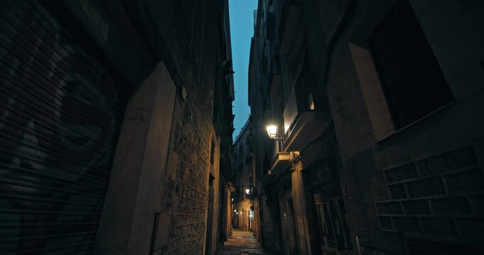 Urban night landscape of the Gothic Quarter in Barcelona. Touristic streets with historical architecture in historical places of Catalonia Spain. High quality 4k footage