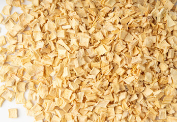 Dry parsley root texture background, dried diced celery cubes pattern, small liquorice pileces banner