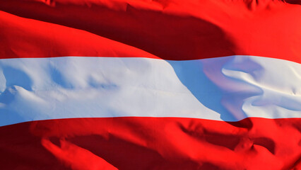 Austria's national flag flutters in the wind