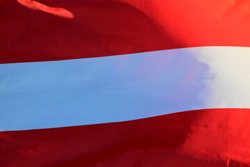 Austria's national flag flutters in the wind