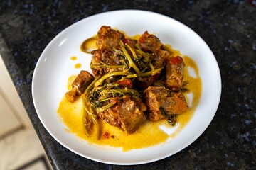 Traditional beef oxtail with watercress, a rustic Brazilian dish