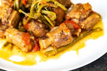 Traditional beef oxtail with watercress, a rustic Brazilian dish