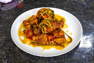 Traditional beef oxtail with watercress, a rustic Brazilian dish
