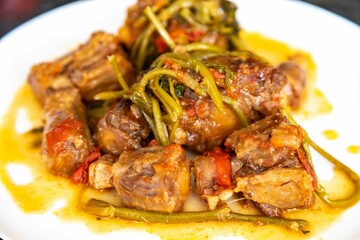 Traditional beef oxtail with watercress, a rustic Brazilian dish
