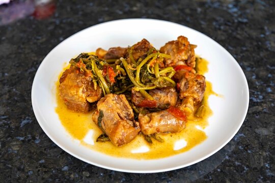 Traditional beef oxtail with watercress, a rustic Brazilian dish