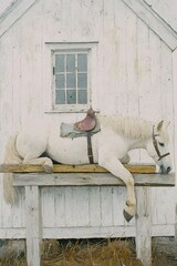 Resting Horse: A weary white horse leans against a weathered wooden structure, its saddle suggesting a recent ride, set against the backdrop of a rustic white building.
