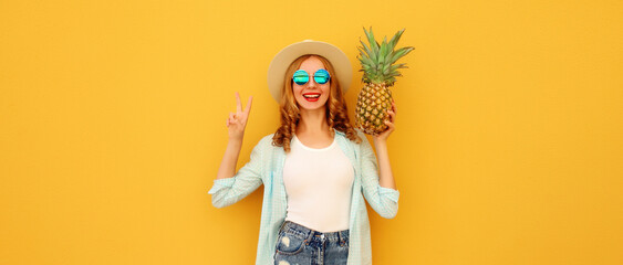 Summer vacation, happy joyful young woman with pineapple fruit, cheerful girl on yellow background