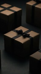 Several small brown gift boxes tied with black ribbons