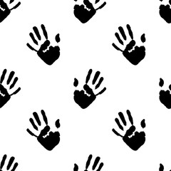 Fototapeta premium Seamless pattern of ink handprints on white background. Design background for wallpaper, textile, prints and fabric.