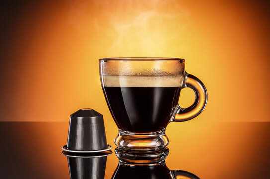 Freshly brewed espresso in a cup with capsule