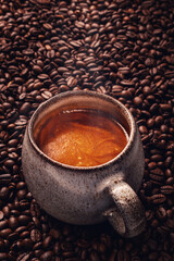 Fresh Espresso Coffee on Roasted Beans