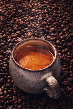 Fresh Espresso Coffee on Roasted Beans