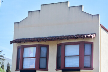 The facade of a building with large windows.