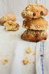Yeast buns with raisins and crumble on a white background, homemade baking, sweet buns for breakfast, close-up.