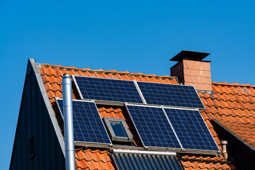 Fototapeta premium Solar panels installed on a roof showcasing renewable energy use