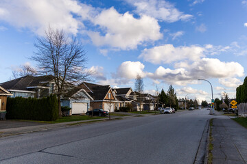 Obraz premium Residential Street in Fraser Heights Surrey, BC with Blue Sky and Clouds