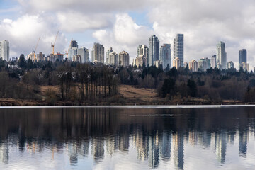 Obraz premium Skyscrapers Reflecting on Deer Lake in Burnaby, Vancouver, BC, Canada