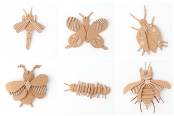 The image shows six different insect figures made out of cardboard. Each insect is crafted using various shapes and textures of cardboard, including smooth and corrugated pieces