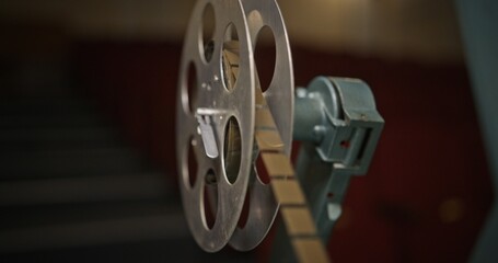 Obraz premium A CloseUp View of a Vintage Film Reel in a Cinema Setting with Nostalgic Cinematic Charm