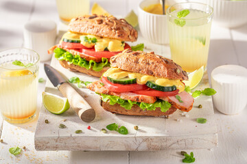 Tasty sandwich with curry chicken, chive and cheese.