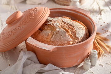 Fresh and homemade loaf of bread baked in home bakery.