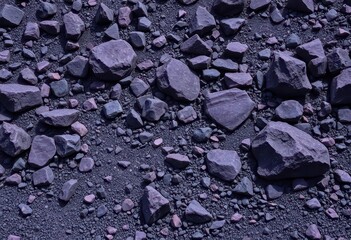 Dark purple boulders, scattered gravel, and small rocks form a rugged geological landscape, arid, brown