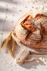 Tasty and homemade round loaf bread baked in home bakery.