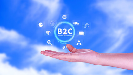 B2C, Business to customer marketing strategy concept. Businessman holding with virtual B2C icon for business strategy, communication, feedback, online marketing, Ecommerce marketing strategy.