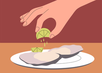 A hand squeezing fresh lime juice over oysters on a plate for a zesty seafood flavor