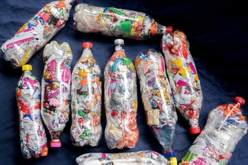 Recycling and sustainability. Plastic bottles filled with packaging. Bottles of love'. Botellas de amor. Ecological bricks. Ecoladrillos