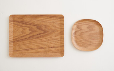 Rectangular and square wooden tray with natural grain texture, isolated on white background. Top view