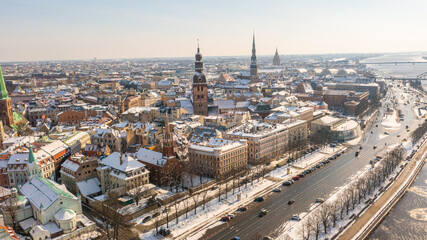 Obraz premium Riga, Latvia, Beautiful panoramic aerial photo from drone to Old Riga on a beautiful sunny winter day. (series)