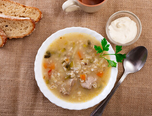 Rassolnik: popular Russian soup with pickled cucumbers, brine and pearl barley