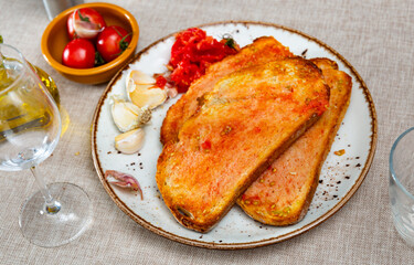 Sandwiches slices of fragrant bread smeared with olive oil and juice of fresh sweet and sour tomatoes