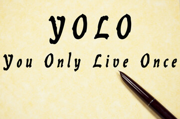 You Only Live Once write on paper