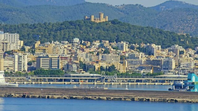 PALMA, MALLORCA , SPAIN- MAY 25, 2024: The Castell de Bellver high on a hill overlooks El Torreno at the Port of Palma on the island of Mallorca. Majorca, is the largest of the Balearic Islands.