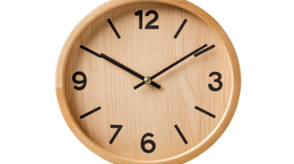 A wooden alarm clock with the hands on the numbers 3 and 9