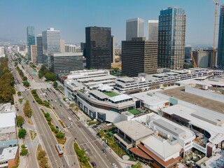 Naklejka na ściany i meble Aerial view of Century City, Los Angeles, California, USA, showcasing the urban landscape with its modern architecture, busy streets, and commercial activity.
