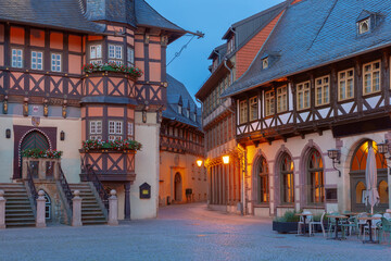 Historic half-timbered houses in the old town of Wernigerode, Germany, at dusk
