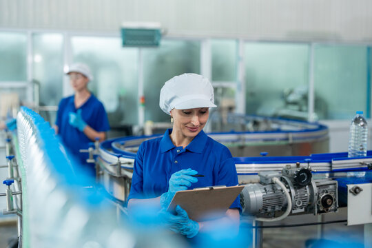 Caucasian female industry worker team working in factory warehouse. - Powered by Adobe