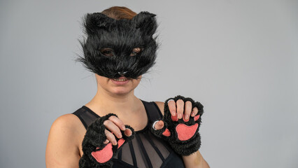Portrait of a woman in a cat costume on a white background. Quadrober. 